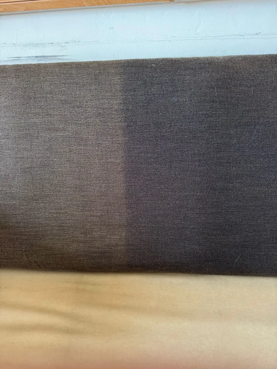 Dark fabric panel half cleaned, before and after Dark fabric panel half cleaned, before and after