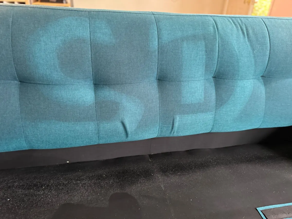 βSDβ cleaned into a teal sofa back, showing how much soil fabric holds βSDβ cleaned into a teal sofa back, showing how much soil fabric holds