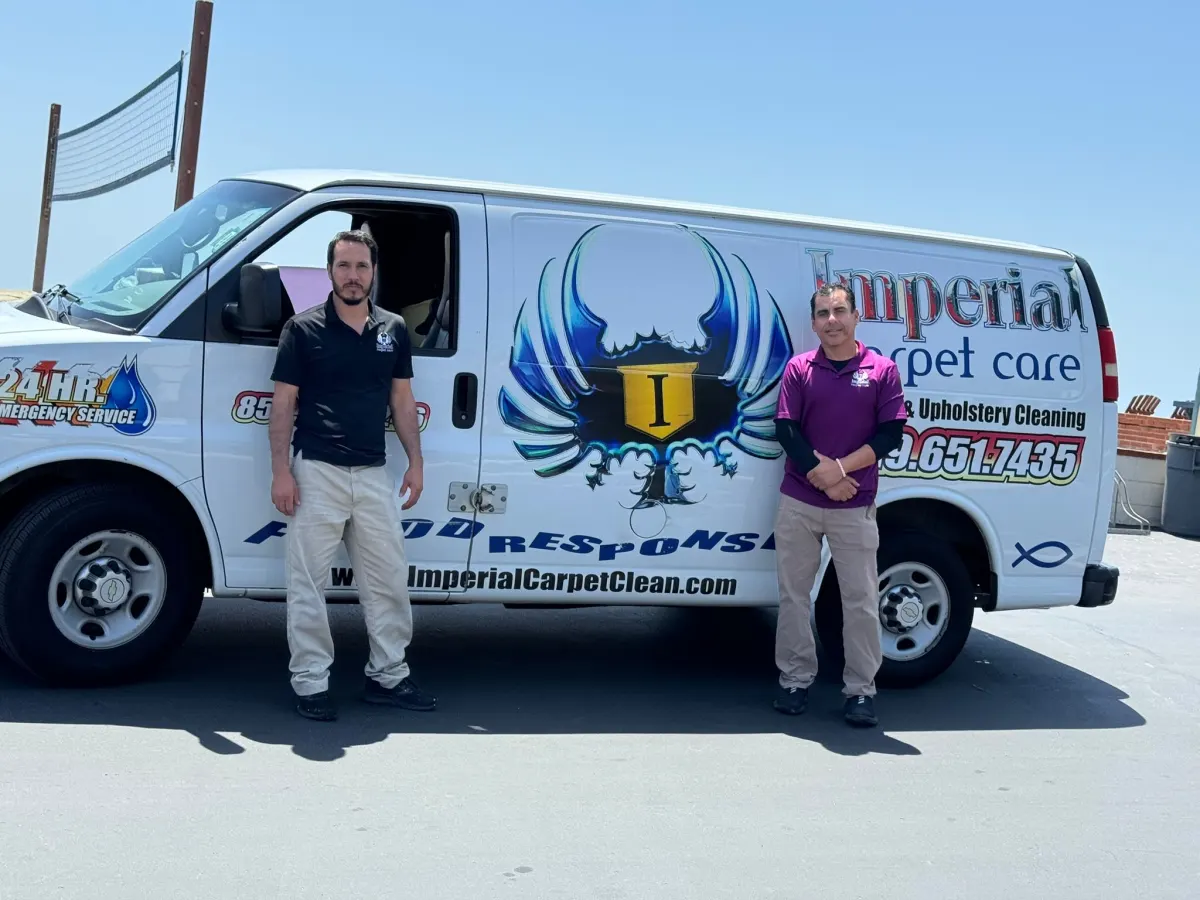 Two Imperial technicians standing by the flood response van Two Imperial technicians standing by the flood response van