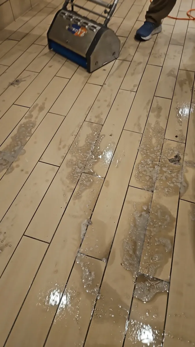 Machine scrubbing wood-look tile and grout Machine scrubbing wood-look tile and grout